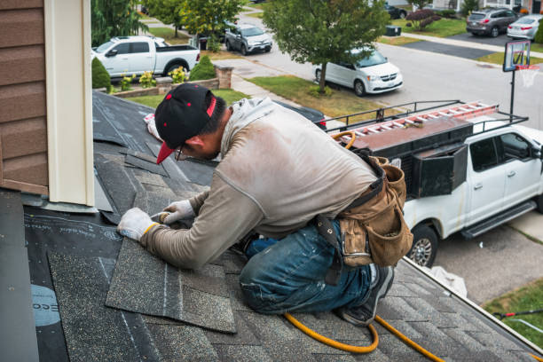 Professional Roof Replacement technician working in Jericho, NY